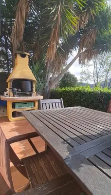 a picnic table with a tv on top of it at Villa cascada in Sant Cebrià de Vallalta