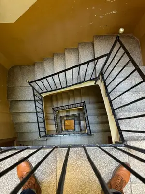 a person standing on top of a spiral staircase at Unique Ramblas in Barcelona