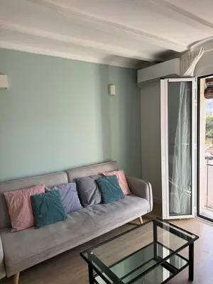 a living room with a couch and a glass table at Unique Ramblas in Barcelona