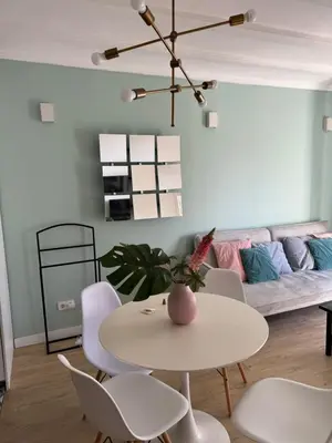 a living room with a table and chairs and a couch at Unique Ramblas in Barcelona