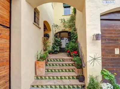 a stairway leading up to a house with flowers at Masia Las Torres by Hello Homes Sitges in Sitges