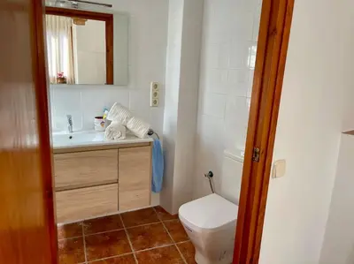 a small bathroom with a toilet and a sink at Ca la Neus - Casa per 8 persones al poble de Mura in Mura