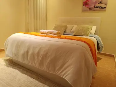 a bedroom with a bed in a room with a window at Habitación y baño privado in Vilanova del Camí
