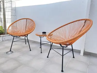two chairs and a table in a room at Beautiful renovated studio in Castelldefels