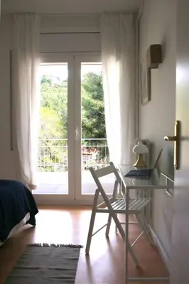 a room with a glass desk and a glass window at VILLA Mar y Montaña in Castelldefels