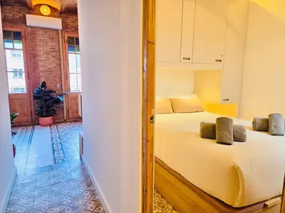 a bedroom with two beds in a room at Stunning APT WiFi 6 min Sagrada Familia 2BR in Barcelona