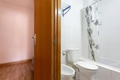 a bathroom with a toilet and a bath tub at Apartamento en castelldefels in Castelldefels