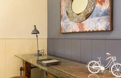 a bike sitting on a table with a mirror at Rustic Casita Gavà in Barcelona