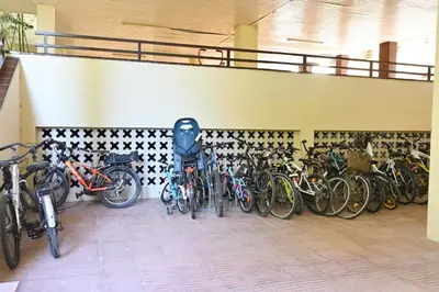 a bunch of bikes are lined up against a wall at Apartamento con piscina en Sant Pol de Mar in San Pol de Mar