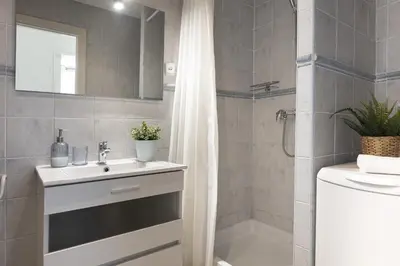 a bathroom with a sink and a shower at Bright Apartment In Gava Mar in Gavà