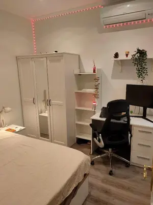 a bedroom with a bed and a desk and a computer at Vilamari 33 - 2 bedroom apartment in Barcelona