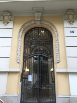 an entrance to a building with a black door at Vilamari 33 - 2 bedroom apartment in Barcelona