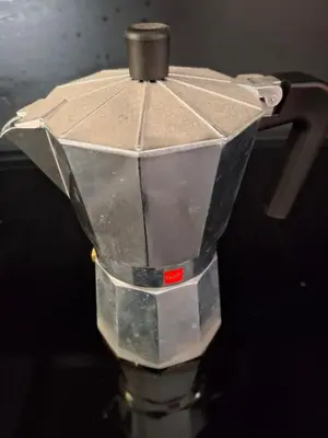 a metal robot sitting on top of a table at Vilamari 33 - 2 bedroom apartment in Barcelona