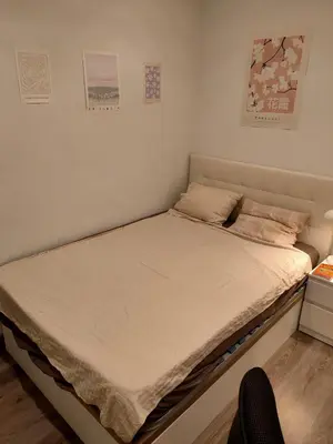 a small bed in a room with at Vilamari 33 - 2 bedroom apartment in Barcelona