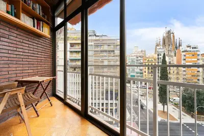 a balcony with a bench and a view of a city at 180m² 5BR Home Lift Terrace 32 Nights in Barcelona