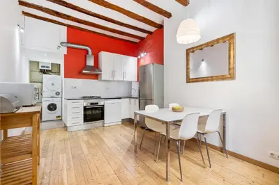 a living room with a couch and a brick wall at Historic El Born 2BR Monthly Stay Workspace in Barcelona