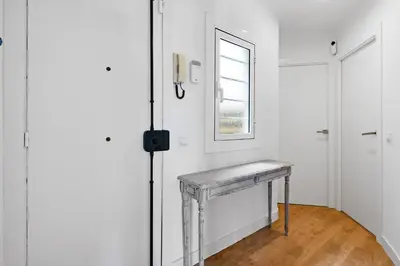 a bedroom with a blue and white bed with pillows at 55m² Monthly Base w Terrace AC in Barcelona