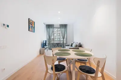 a dining room with a table and chairs at Diagonal Mar Monthly 2BR Pools Parking in Barcelona