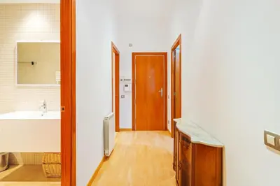 a bathroom with a sink and a toilet and a tub at Quiet, vibrant 2 bedroom in pedestrian Eixample in Barcelona