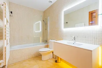 a mirror in a room with a bunk bed at Quiet, vibrant 2 bedroom in pedestrian Eixample in Barcelona