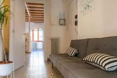 a living room with a couch and a hallway at 