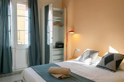 a bedroom with a large bed and a window at 