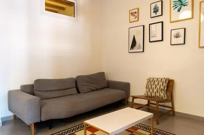 a living room with a couch and a chair at 