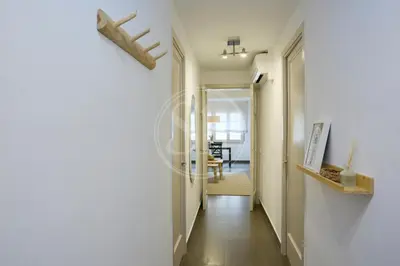 an open door to a balcony in a building at Céntrico apartamento in Barcelona