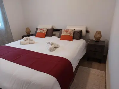 a bedroom with a large bed with towels on it at Casa del Campo in Els Hostalets