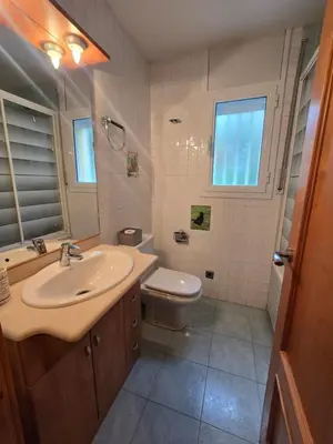 a bathroom with a sink and a toilet at Casa del Campo in Els Hostalets