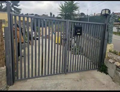 a gate in a driveway with at Casa del Campo in Els Hostalets