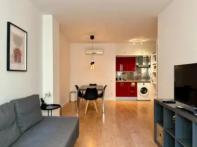 a living room with a couch and a table at Spacious 1 bedroom home in Bonanova in Barcelona