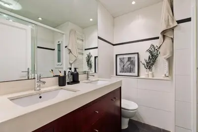 a bedroom with a large bed with two lamps at Sabate - 3 bedrooms and office in Sant Gervasi in Barcelona