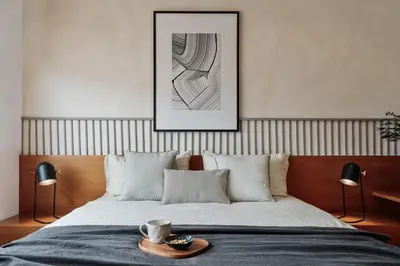 a bedroom with a bed with a picture on the wall at Sabate - 3 bedrooms and office in Sant Gervasi in Barcelona