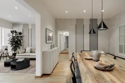 a dining room with a table and chairs and a mirror at Sabate - 3 bedrooms and office in Sant Gervasi in Barcelona