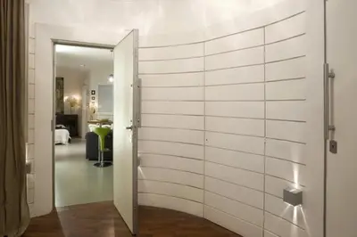 a room with a white wall with a door at City Center Apartment in Barcelona