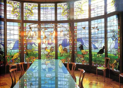 a room with a table and a large stained glass window at City Center Apartment in Barcelona