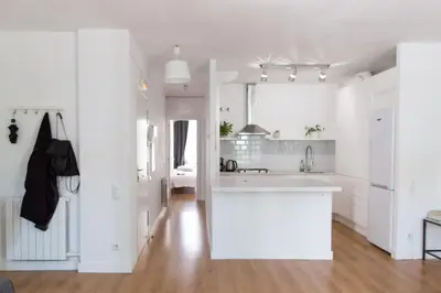 a kitchen with white walls and a white counter top at Central Apartment in Barcelona