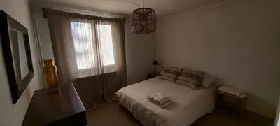 a bedroom with a white bed and a window at A Country and Vineyard Retreat in San Martín Sarroca
