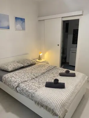 a bedroom with a bed with two towels on it at Apartamento Barcelona in Barcelona