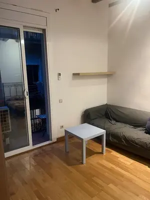 a living room with a couch and a table at Flat in centre of Barcelona in Barcelona