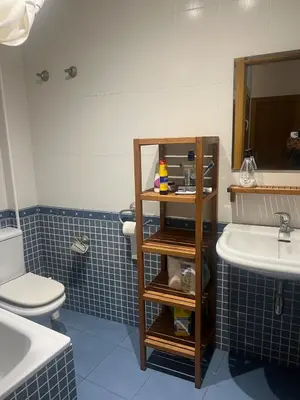 a bathroom with a white toilet and a sink at Flat in centre of Barcelona in Barcelona
