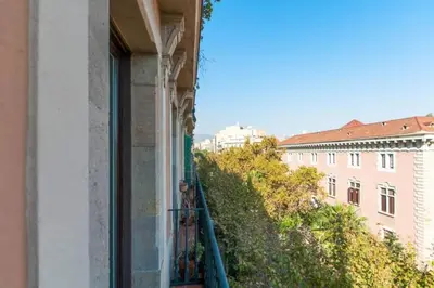 a balcony with a view of a building at Explore City Center from an Elegant Urban Retreat in Barcelona