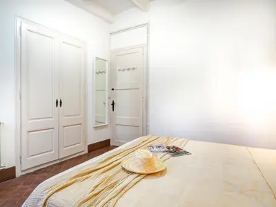 a room with a bed with a hat on it at Las Ventanas Sea Front by Hello Homes Sitges in Sitges