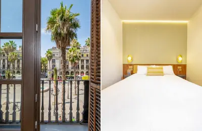 a bedroom with a bed and a balcony with a palm tree at Hostal Ambos Mundos in Barcelona
