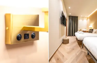 a hotel room with two beds and a tv at Hostal Ambos Mundos in Barcelona