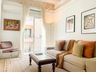 a living room with a couch and a coffee table at Boutique Radas in Barcelona