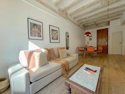 a living room with a couch and a table at Boutique Radas in Barcelona