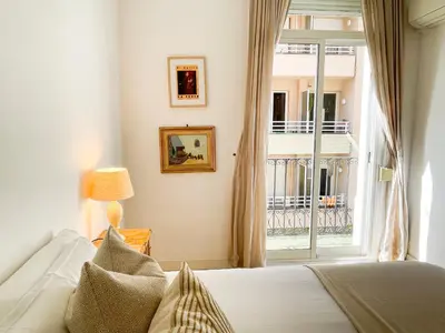a bedroom with a bed and a large window at Boutique Radas in Barcelona