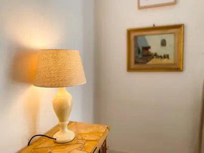 a lamp sitting on top of a table in a room at Boutique Radas in Barcelona